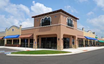 CL-Real-Estate.jpeg Outside view of a modern strip mall
