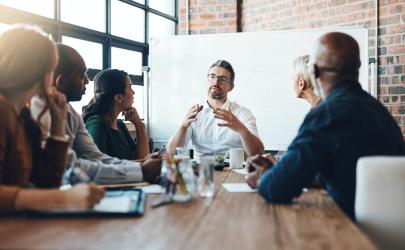 Employees holding a working group, talking in a boardroom