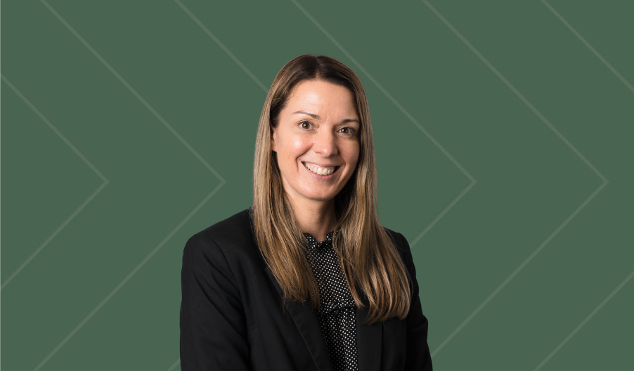 headshot of a woman with a green background